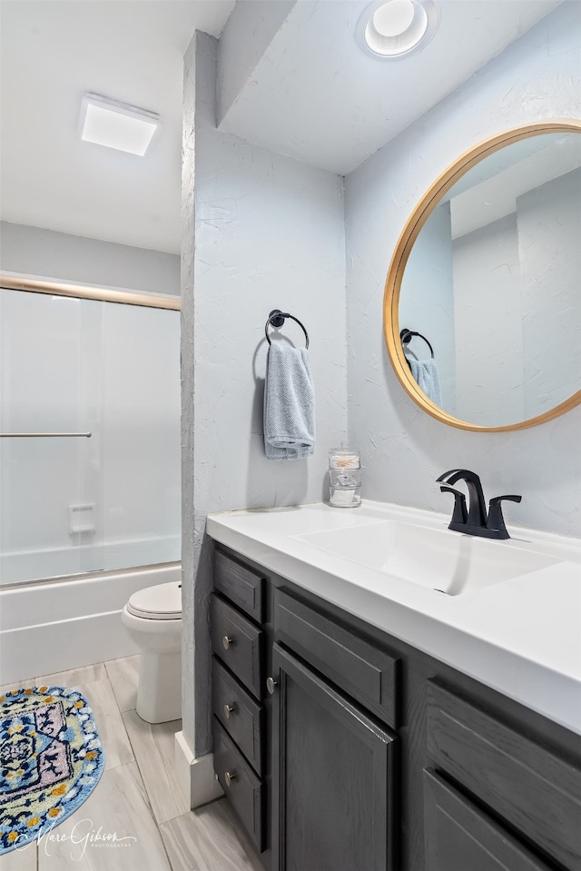 full bathroom featuring toilet, shower / washtub combination, and vanity