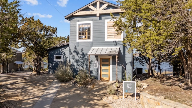 view of front facade featuring a standing seam roof and metal roof