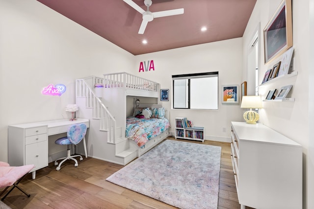 bedroom featuring baseboards, ceiling fan, wood finished floors, and recessed lighting