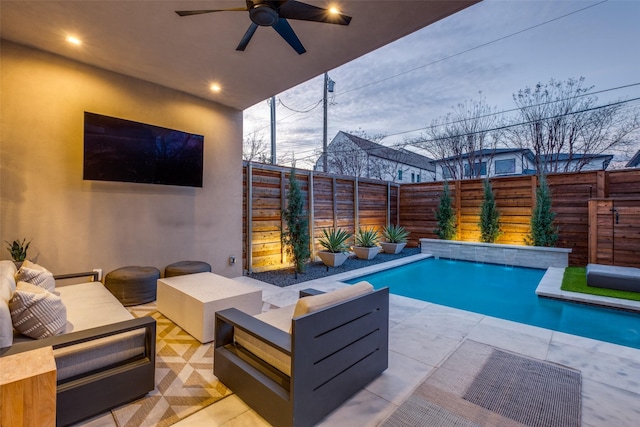 view of swimming pool featuring a fenced in pool, a fenced backyard, ceiling fan, a patio area, and an outdoor living space