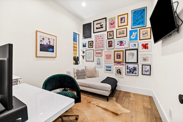 home office with recessed lighting, baseboards, and wood finished floors