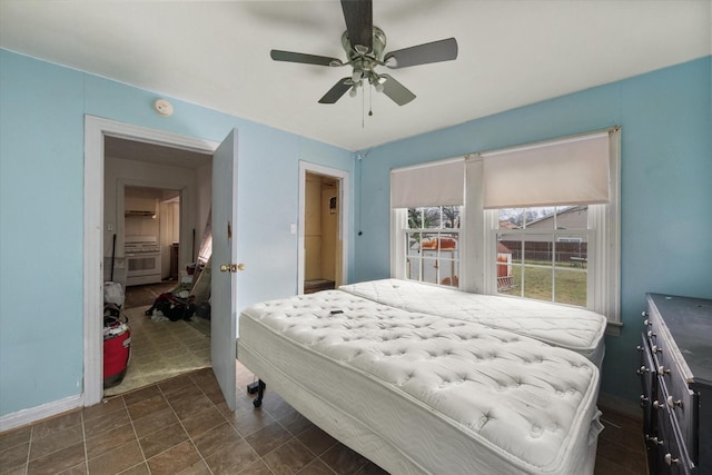 bedroom with baseboards and a ceiling fan