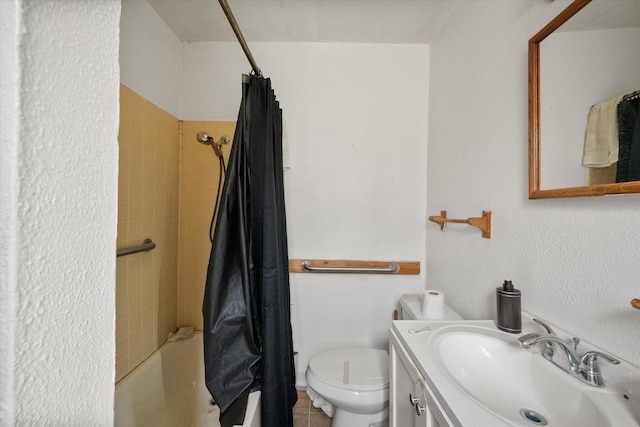 bathroom with tile patterned flooring, shower / tub combo with curtain, vanity, and toilet