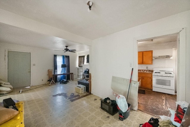 living area featuring ceiling fan and light floors