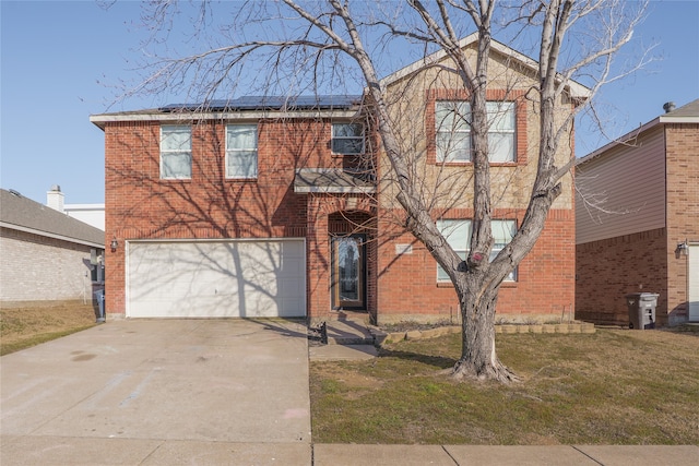 view of front of home featuring brick siding, roof mounted solar panels, a garage, driveway, and a front lawn