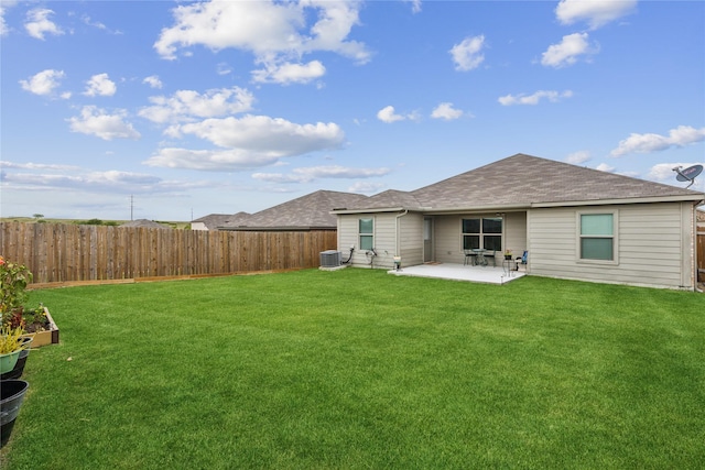 back of house with a patio area, a fenced backyard, central AC unit, and a yard