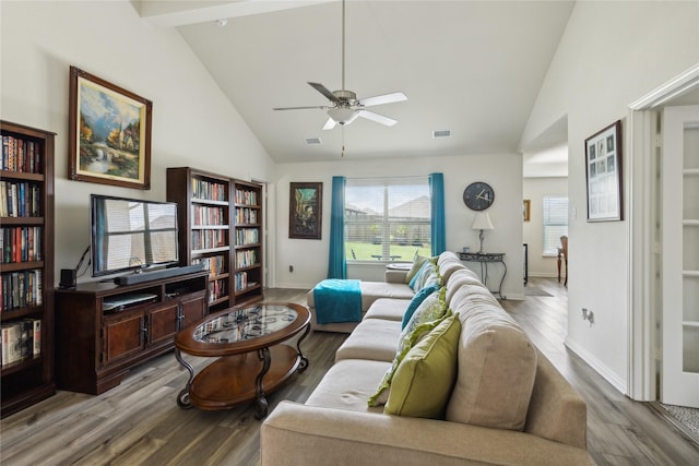 living area featuring high vaulted ceiling, a ceiling fan, baseboards, and wood finished floors