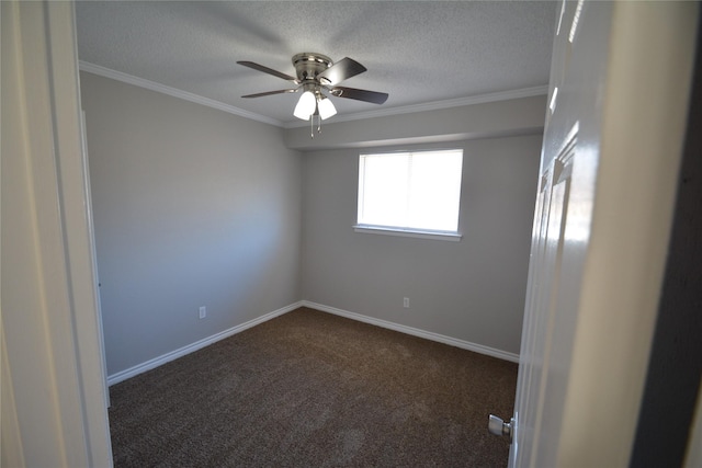 unfurnished room featuring crown molding, dark carpet, a textured ceiling, and baseboards