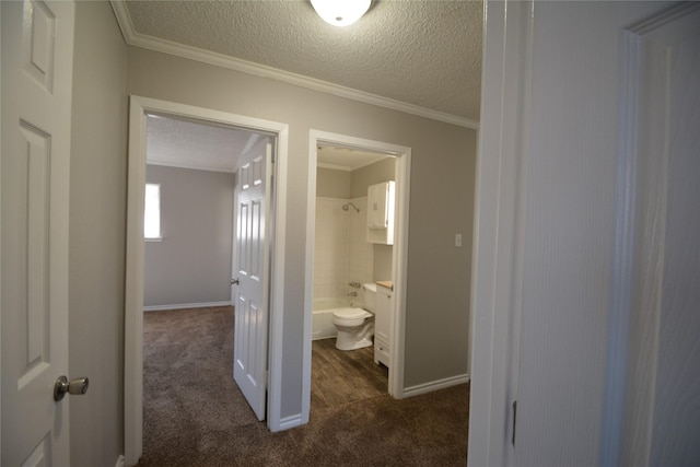 interior space featuring ornamental molding, bathtub / shower combination, and a textured ceiling