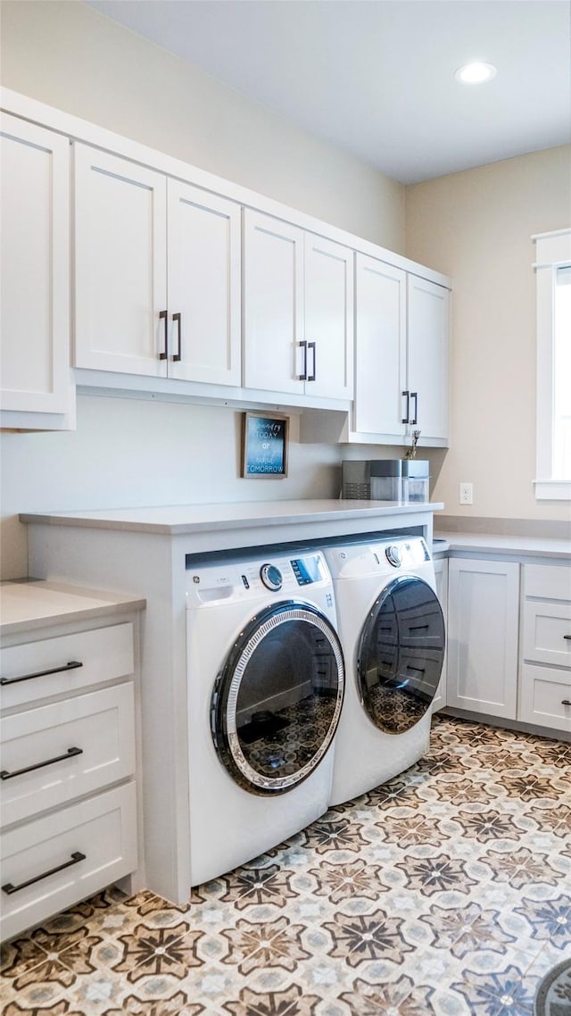 laundry area with recessed lighting, cabinet space, independent washer and dryer, and tile patterned floors