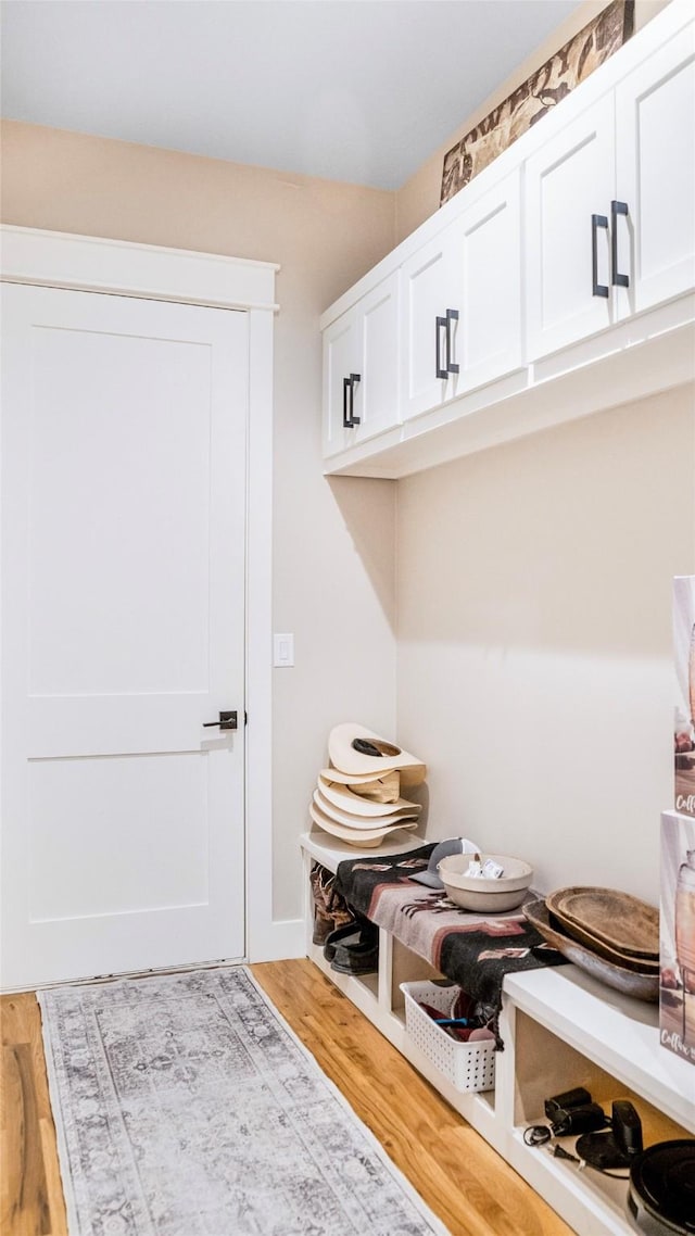 mudroom with wood finished floors