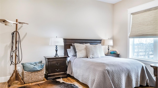 bedroom with wood finished floors