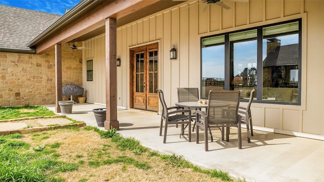 view of patio / terrace featuring french doors, outdoor dining space, and a ceiling fan