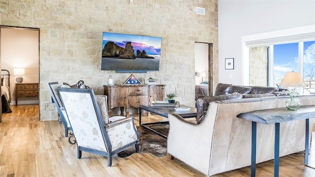 living room featuring wood finished floors and visible vents