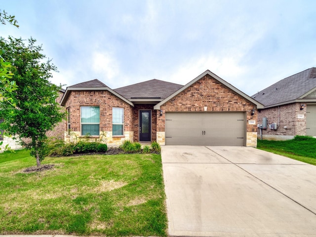 ranch-style house featuring a garage, brick siding, a shingled roof, driveway, and a front yard