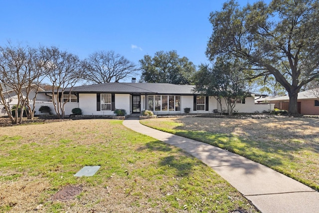 ranch-style house with a front yard