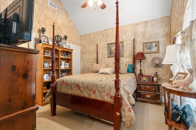 carpeted bedroom with high vaulted ceiling and visible vents