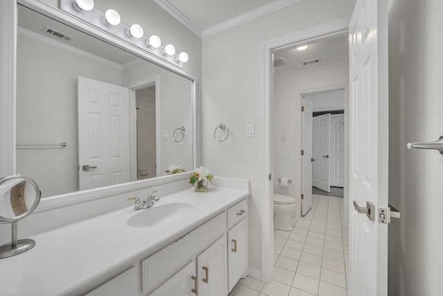 bathroom featuring visible vents, crown molding, vanity, and toilet