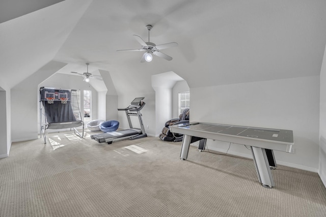 exercise room featuring lofted ceiling, carpet floors, ceiling fan, and baseboards