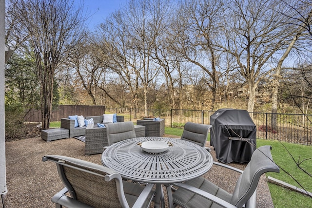 view of patio / terrace with an outdoor hangout area, area for grilling, and a fenced backyard