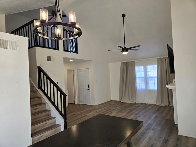 interior space with visible vents, stairway, and wood finished floors