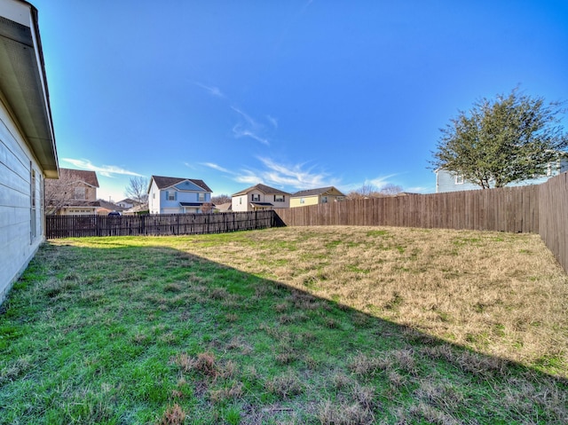 view of yard featuring a fenced backyard