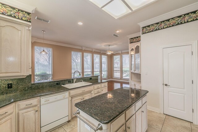 128 Oakview Dr, Hudson Oaks, TX 76087 - kitchen featuring dishwasher, a sink, crown molding, healthy amount of natural light, and light tile patterned floors