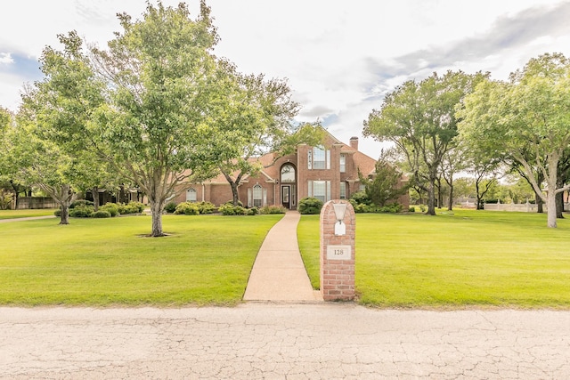 128 Oakview Dr, Hudson Oaks, TX 76087 - view of front of property with a front yard, brick siding, and a chimney