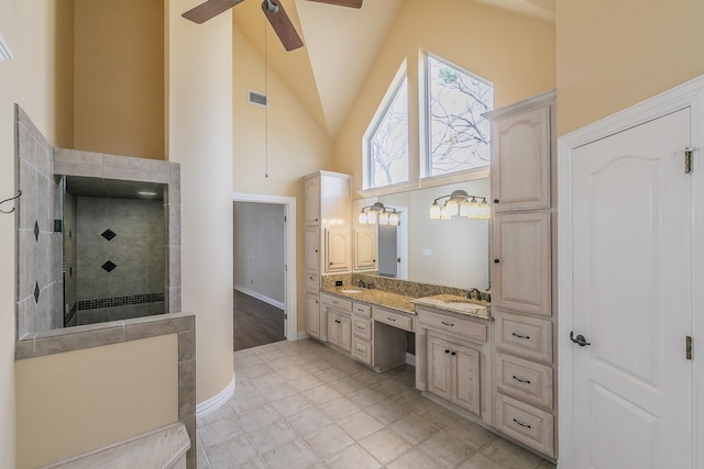 128 Oakview Dr, Hudson Oaks, TX 76087 - full bath featuring high vaulted ceiling, ceiling fan, walk in shower, double vanity, and baseboards