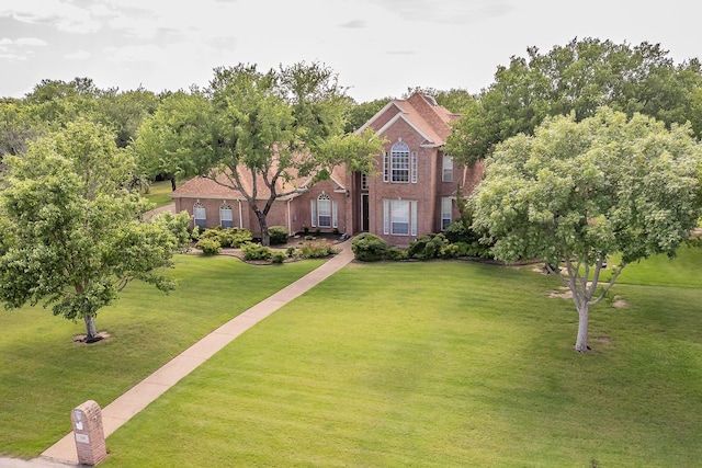 128 Oakview Dr, Hudson Oaks, TX 76087 - view of front of home featuring brick siding and a front lawn