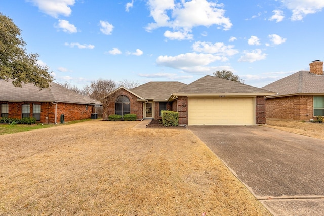7425 Dana Ln, North Richland Hills, TX 76182 - ranch-style home with driveway, brick siding, roof with shingles, an attached garage, and a front yard