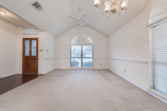 7425 Dana Ln, North Richland Hills, TX 76182 - carpeted entryway with baseboards, visible vents, vaulted ceiling, and ceiling fan with notable chandelier