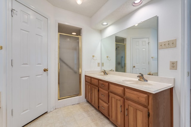 7425 Dana Ln, North Richland Hills, TX 76182 - bathroom featuring a stall shower, a sink, recessed lighting, and double vanity