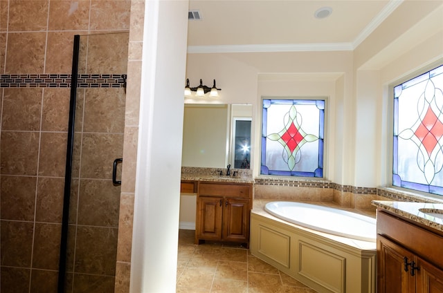 bathroom featuring a garden tub, two vanities, ornamental molding, a stall shower, and a sink