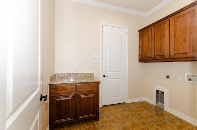 washroom featuring hookup for a washing machine, baseboards, ornamental molding, cabinet space, and electric dryer hookup