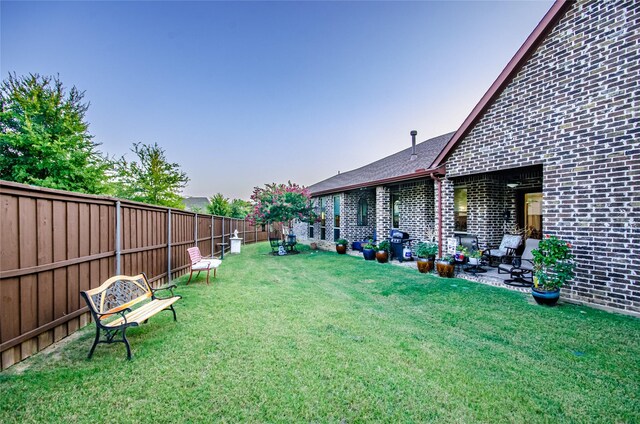 view of yard with a fenced backyard