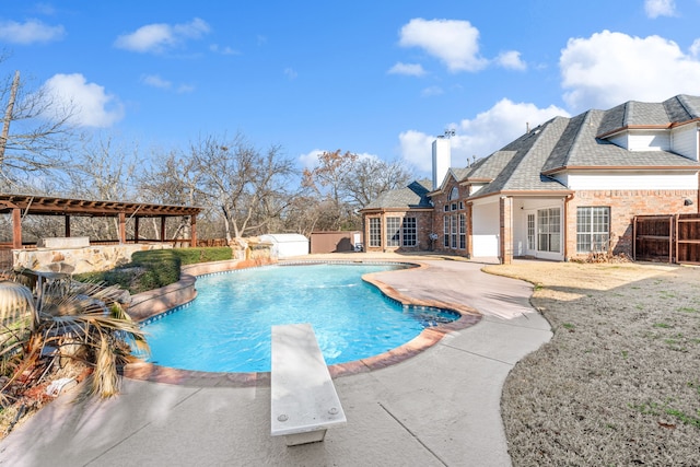 view of swimming pool with a fenced backyard, a diving board, a fenced in pool, and a patio