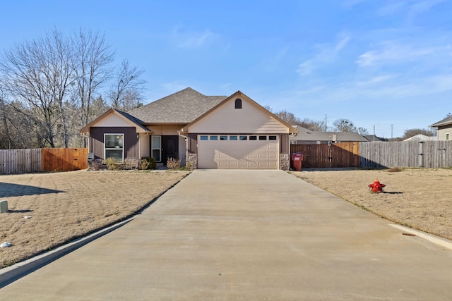 single story home featuring driveway, an attached garage, fence, and a gate