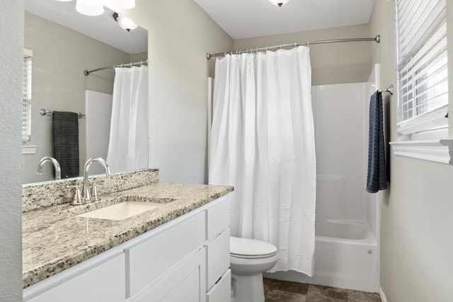 full bath featuring toilet, shower / tub combo with curtain, and vanity