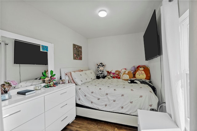 bedroom featuring dark wood-type flooring