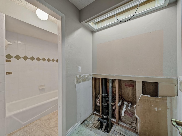 full bath featuring shower / bathing tub combination and tile patterned flooring