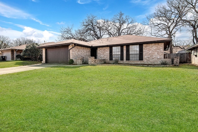 view of front of property featuring brick siding, a garage, a front yard, and driveway