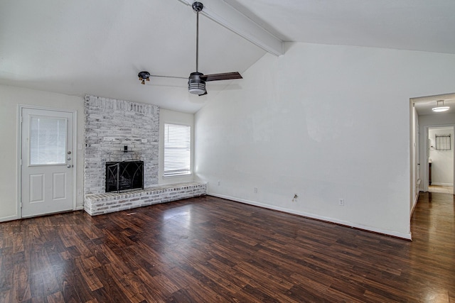 unfurnished living room featuring a brick fireplace, vaulted ceiling with beams, baseboards, ceiling fan, and dark wood-style floors