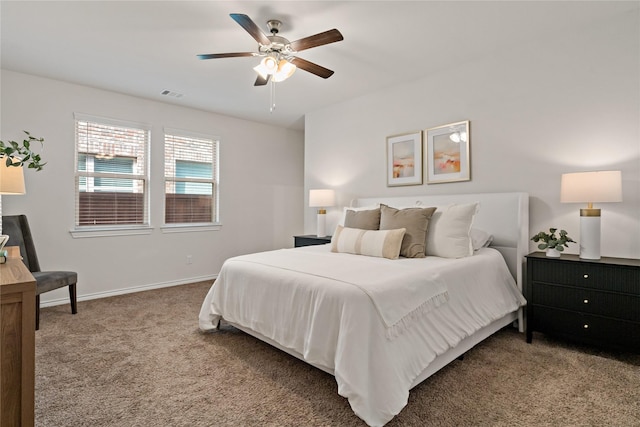 bedroom featuring carpet floors, visible vents, baseboards, and a ceiling fan