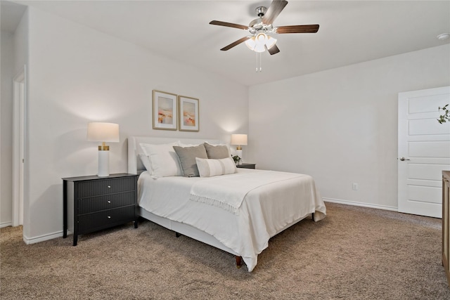 bedroom with carpet flooring, a ceiling fan, and baseboards