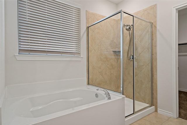 full bath with tile patterned flooring, a shower stall, and a bath