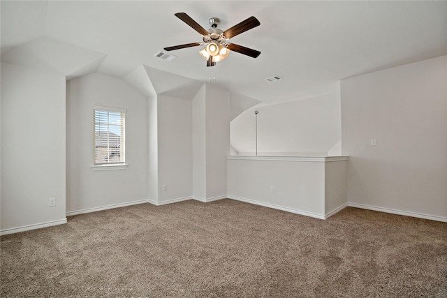 bonus room with ceiling fan, lofted ceiling, carpet flooring, visible vents, and baseboards