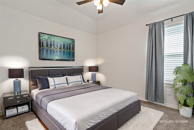 carpeted bedroom featuring a ceiling fan and baseboards