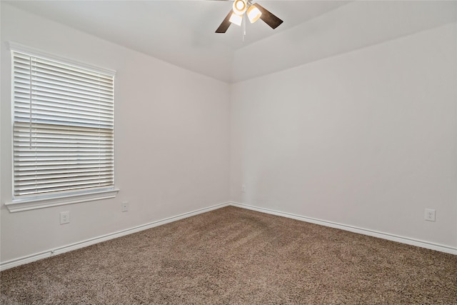 empty room with baseboards, a ceiling fan, and carpet flooring