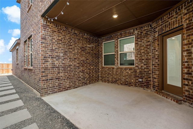 view of patio / terrace featuring fence